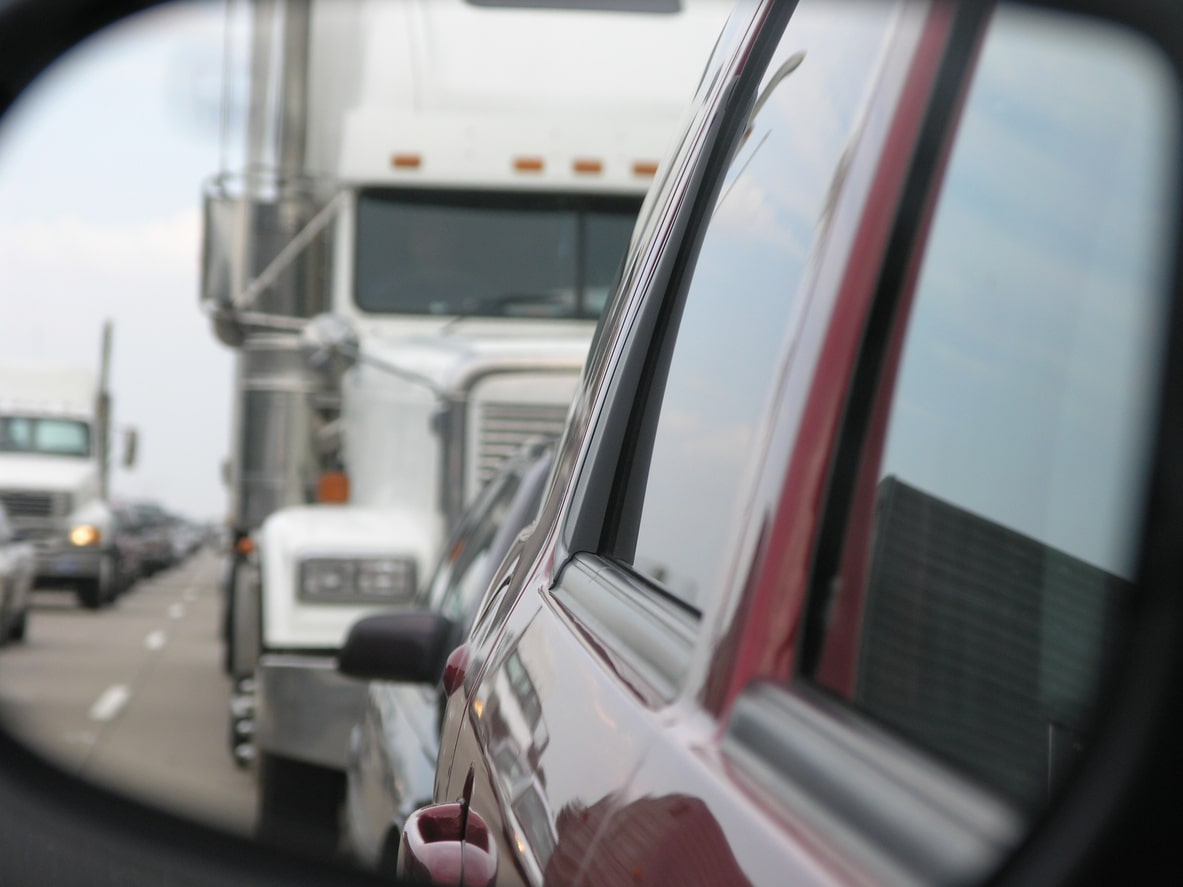 18-Wheeler behind a car